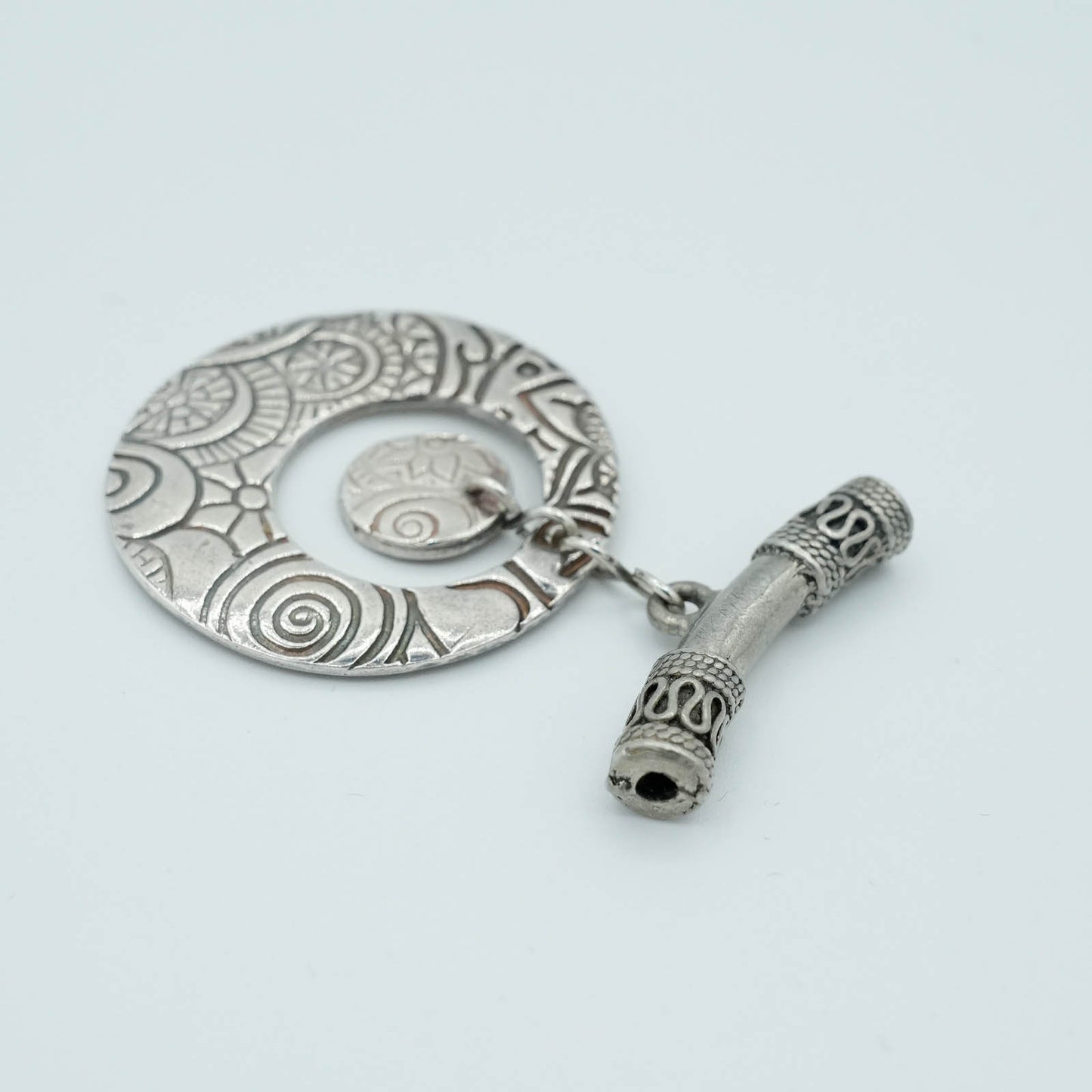 Textured and shaped Precious Metal Clay Pendant with decorative tubular chain detail