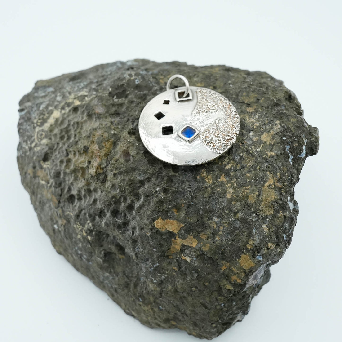Circular Precious Metal Clay Textured Pendant with Blue Sapphires