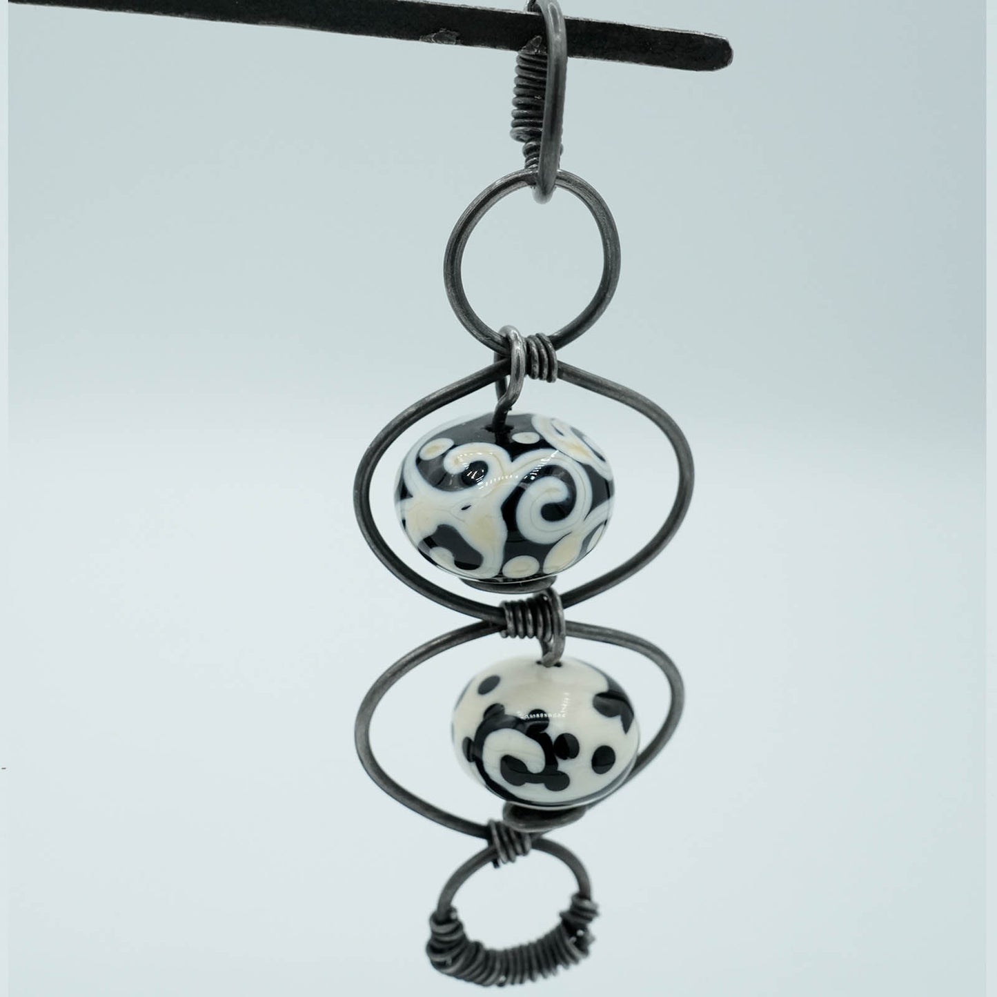 Hollow Lamp-worked Glass Beads and Steel Wire Pendant