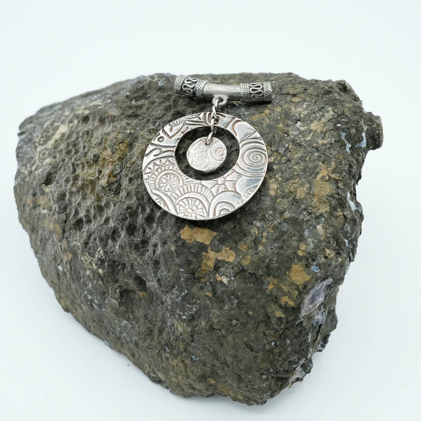 Textured and shaped Precious Metal Clay Pendant with decorative tubular chain detail