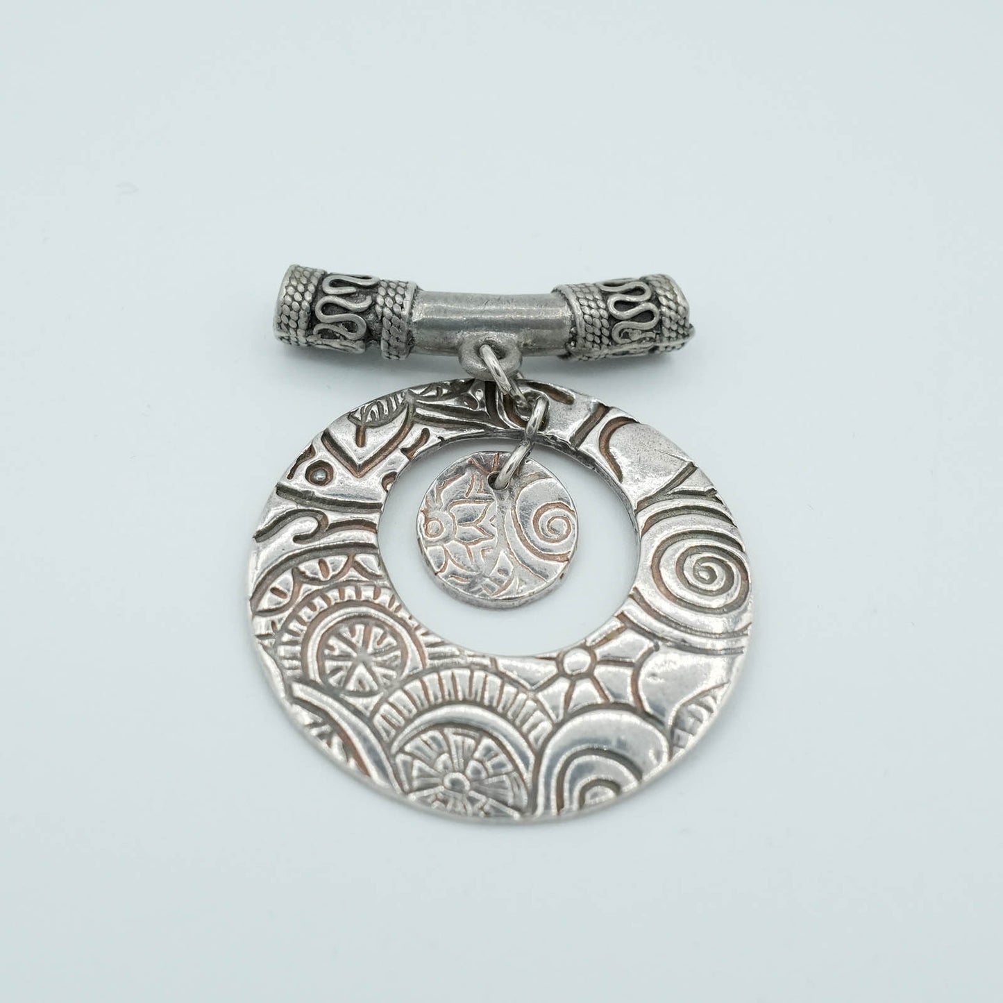 Textured and shaped Precious Metal Clay Pendant with decorative tubular chain detail