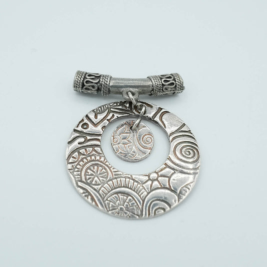 Textured and shaped Precious Metal Clay Pendant with decorative tubular chain detail