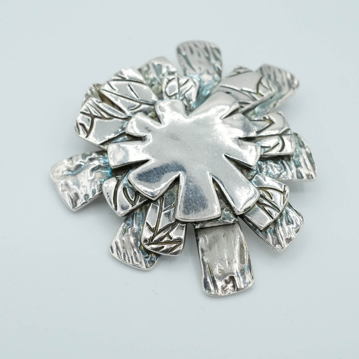 Textured Star Burst shaped Precious Metal Clay Pendant with Raised Texture and Patina
