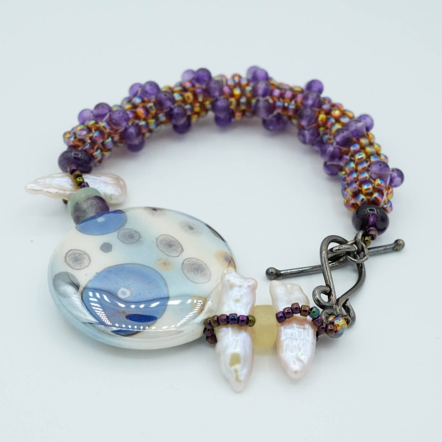 Playful circular Flat Bead with Seed Bead and Crystal Bracelet - Purple tube stitch seed beads