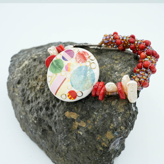 Playful Flat Bead with Red tubular seed bead Bracelet