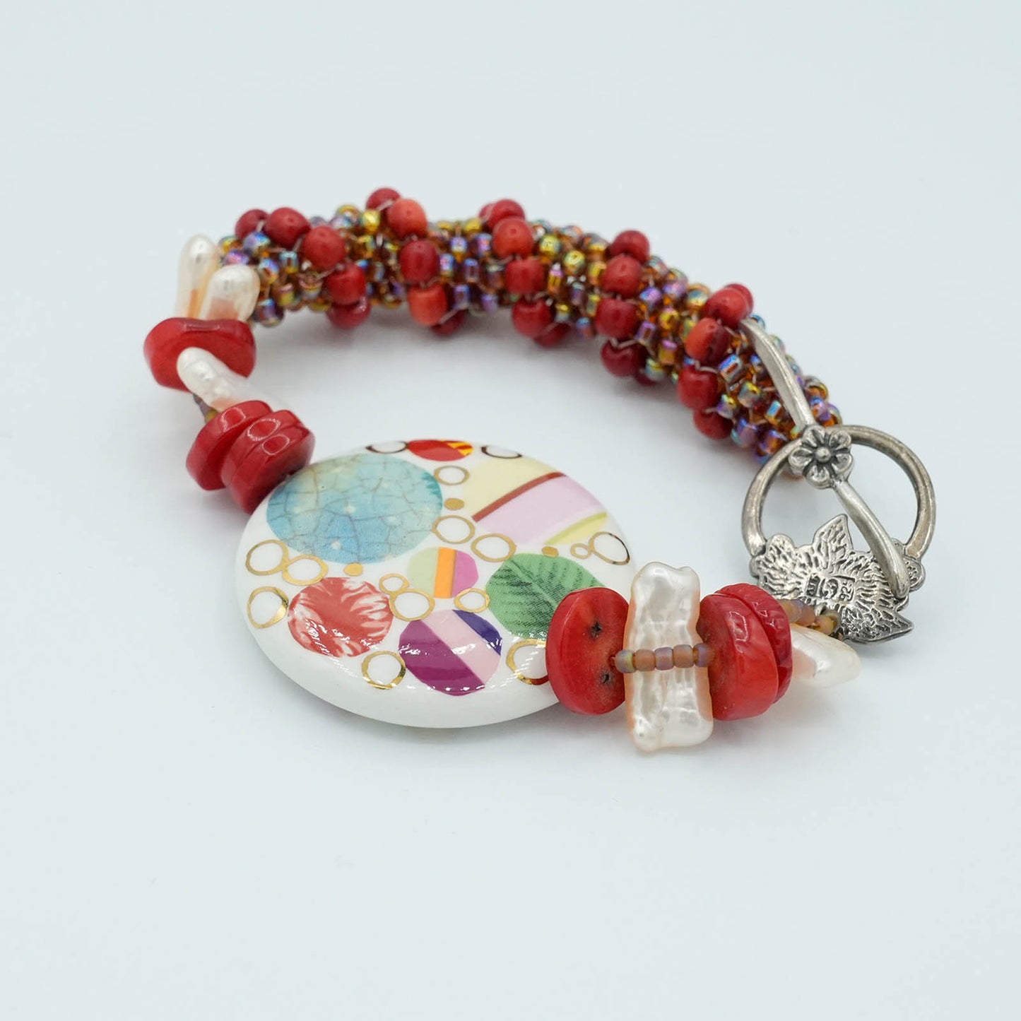 Playful Flat Bead with Red tubular seed bead Bracelet